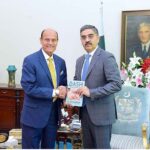 Hockey legend, former Captain of Pakistan National Hockey Team, Islahuddin Siddiqui presenting his book titled "Dash Through My Life" to Caretaker Prime Minister Anwaar-ul-Haq Kakar