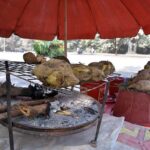 A vendor displaying sweet potatoes to attract customers at his set up at Chak Shahzad neighbourhood in the Federal Capital