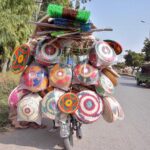 A street vendor displaying different kind of household stuff to attract customers at Lehtrar Road in the Federal Capital