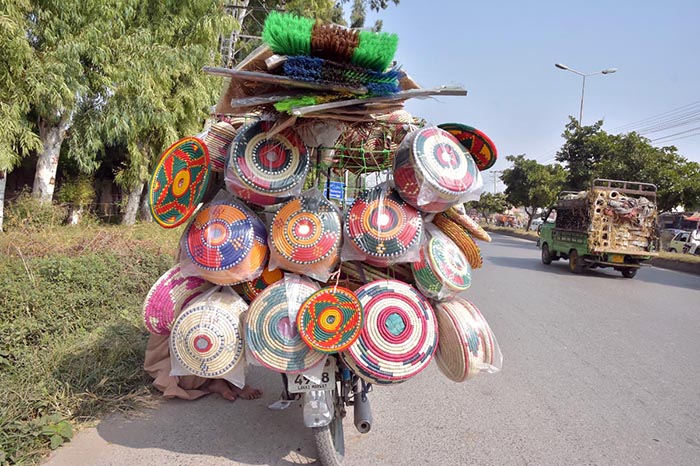 A street vendor displaying different kind of household stuff to attract customers at Lehtrar Road in the Federal Capital