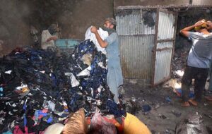 Workers busy in reprocessing the clothes for preparing quilts at their workplace