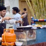 Vendor preparing and selling chips to attract the customer at Kohati area.