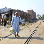 An elderly person crossing railway track while a train approaching may cause any mishap and needs the attention of concerned authorities at Sabzi Mandi