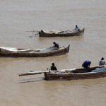 Fishermen preparing net for catching the fishes at Indus river