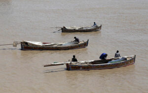 Fishermen preparing net for catching the fishes at Indus river
