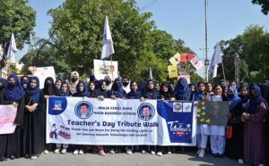 Students participating in a walk to mark World Teachers’ Day at University of Sargodha. 