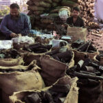 A vendor selling coal during the winter season at his setup