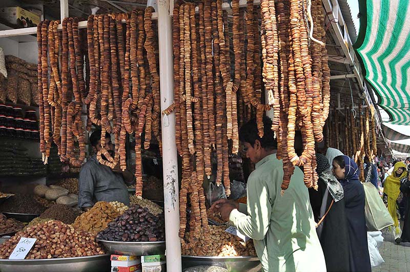 Vendors displaying dry fruits to attract the customers at weekly Sunday Bazaar, Peshawar Morr
