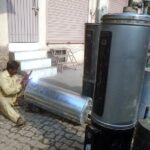 A worker busy in making gas geyser at railway road