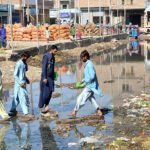 People passing through sewerage water accumulated at Vegetable Market creating problems and needs the attention of concerned authorities.