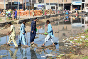 People passing through sewerage water accumulated at Vegetable Market creating problems and needs the attention of concerned authorities.