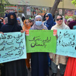 Polio Health workers participating in a polio awareness walk during world polio day outside press club