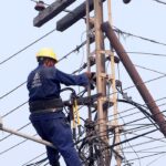 MEPCO staffer busy in installation work of electric cable at Katchery Road.