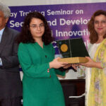 DG IPO Shazia Adnan giving shield to participant during training workshop.
