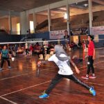 Players in action in badminton match during Punjab Badminton Provincial League (Men,Woman) under Prime Minister Talent Hunt Youth Programme held at Sports Gymnasium.