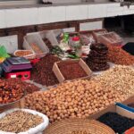 A vendor selling dry fruit on his roadside setup
