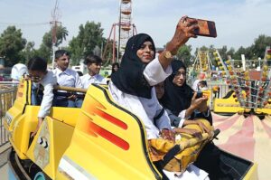 A Special girl capturing the moment through cell phone during World Sight Day organized by Indus Lions Club at Play Land Rani Bagh.