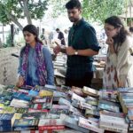 People busy in selecting and purchasing old books from roadside stall in Provincial Capital