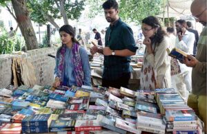 People busy in selecting and purchasing old books from roadside stall in Provincial Capital