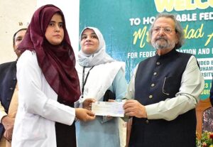 Federal Minister for Education and Professional Training Madad Ali Sindhi addressing during National Endowment Scholarship for Talent (NEST) cheque distribution ceremony at University of Sindh Jamshoro.
