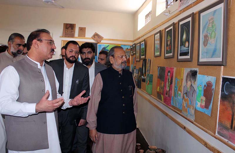 Caretaker Federal Minister for Education and Professional Training Madad Ali Sindi viewing artwork made by prisoners during his visit to Central Jail.