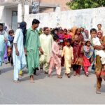 A large number of Sindhi devotees including men, women, and children on the way for the presentation of different shrines in the city