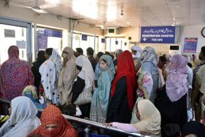 A large number of women waiting to collect slips at the registration counter at the OPD of the District Headquarters Hospital