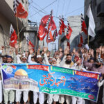 Large number of people attending a rally in solidarity with Palestine during an anti-Israel demonstration at MDA Chowk.