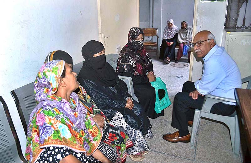 Dr. Muhammad Amjad Saqib, Chairperson Benazir Income Support Programme (BISP) listening the problems of women at Saddar Center during his visit to (BISP) Center