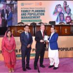Caretaker Federal Health Minister Dr. Nadeem Jan presenting a shield to UNFPA Country Director Dr. Luay Shabaneh at All Pakistan Women Convention on Family Planning and Population Management