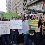 Activists of civil society shout slogans during rally held in support of Palestinians at Karachi Press Club.