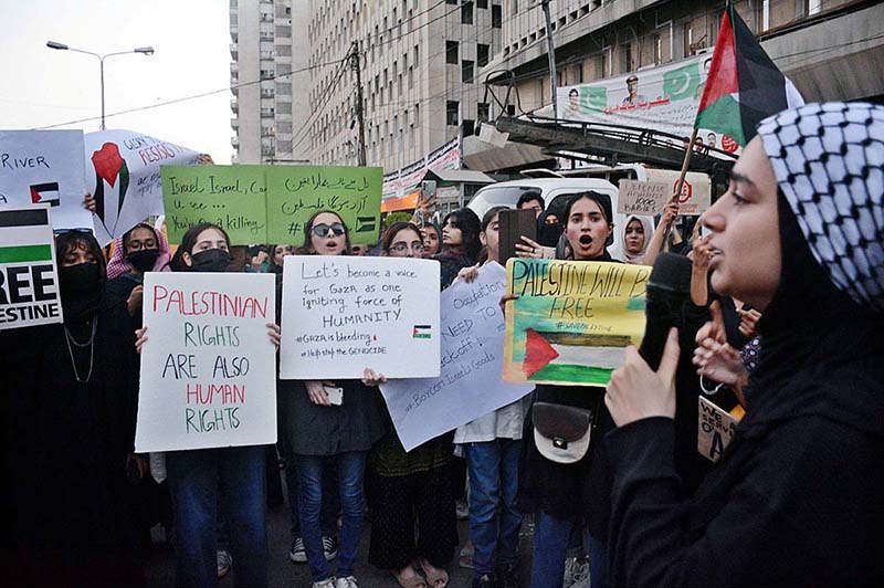 Activists of civil society shout slogans during rally held in support of Palestinians at Karachi Press Club.