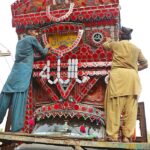 A worker busy in decorated truck body at Hala Naka Road.
