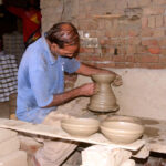 A craftsman preparing clay-made pots at his workplace