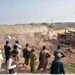 CDA administration demolish a makeshift settlement using heavy machinery on the last day of the deadline fixed by government for illegal immigrants to leave the country in the outskirts of Islamabad