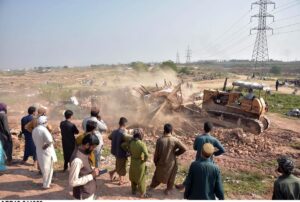  CDA administration demolish a makeshift settlement using heavy machinery on the last day of the deadline fixed by government for illegal immigrants to leave the country in the outskirts of Islamabad