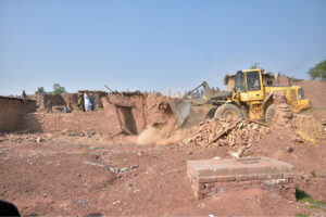 CDA administration demolish a makeshift settlement using heavy machinery on the last day of the deadline fixed by government for illegal immigrants to leave the country in the outskirts of Islamabad