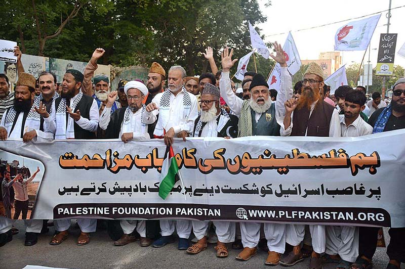 Palestine Foundation Pakistan activists chant slogans against Israel at a protest rally outside Karachi Press Club.