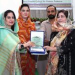 Program officer SPO Mr. Fazli Ghafoor giving shield to Deputy Registrar Affiliation & Monitoring Section Ms Tashfeen Zia during the celebration of International Day of Natural Disaster Reduction at GFC