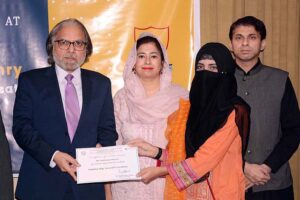 Federal Secretary Ministry of Education & Professional Training Waseem Ajmal Chaudhary is distributing certificates among the students of National Textile University Faisalabad (NTUF) during scholarship distribution ceremony under National Endowment Scholarships for talent holders