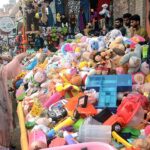 Vendor selling and displaying used toys to attract the customers
