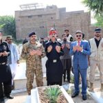 The Caretaker Prime Minister Anwaar-ul-Haq Kakar offers Fateha at the grave of former President Ghulam Ishaaq Khan
