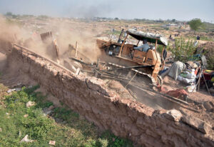 CDA administration demolish a makeshift settlement using heavy machinery on the last day of the deadline fixed by government for illegal immigrants to leave the country in the outskirts of Islamabad