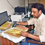 Postman busy in his work on the occasion of World Post Day at the GPO.