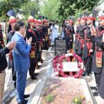 Caretaker Prime Minister Anwaar-ul-Haq Kakar offers fateha and lays floral wreath at the grave of former commandant of FC, Shaheed Sifwat Ghayur