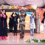 Students performing in tableau on stage during High Achievers ceremony of Beaconhouse FC Campus