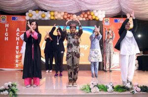  Students performing in tableau on stage during High Achievers ceremony of Beaconhouse FC Campus