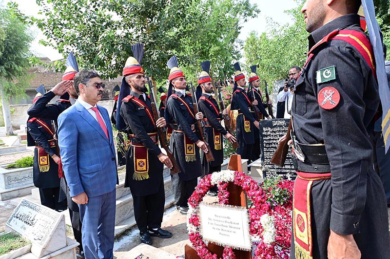 Caretaker Prime Minister Anwaar-ul-Haq Kakar offers Fateha and lays floral wreath at the grave of former commandant of FC, Shaheed Sifwat Ghayur