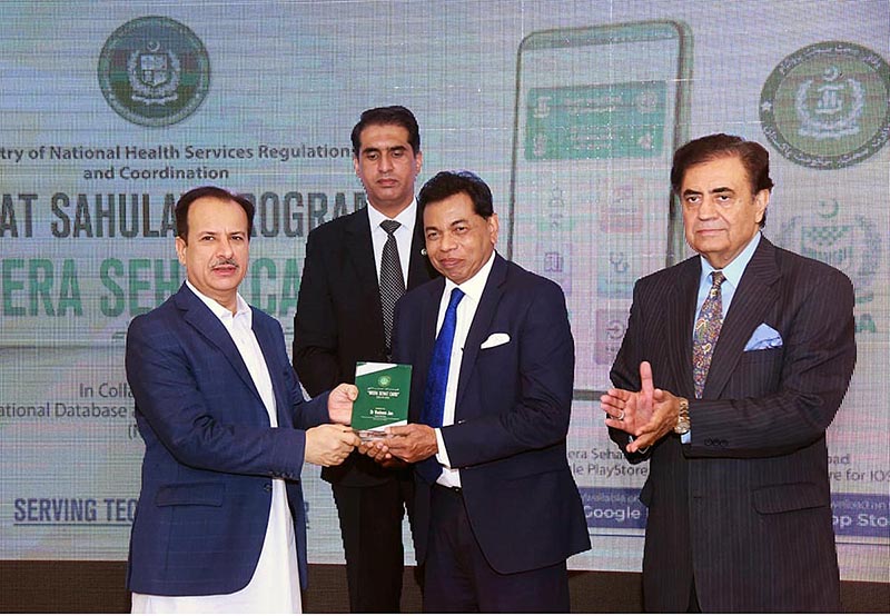 W.H.O Pakistan Mission Head is receiving shield from Federal Minister of National Health Service Regulation and Coordination on the occasion of of "Mera Sehat Card" App launching Ceremony. Minister Health Balochistan is also presentW.H.O Pakistan Mission Head is receiving shield from Federal Minister of National Health Service Regulation and Coordination on the occasion of of "Mera Sehat Card" App launching Ceremony. Minister Health Balochistan is also present