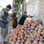 Children are purchasing Golak (money-boxes) at Patel Road